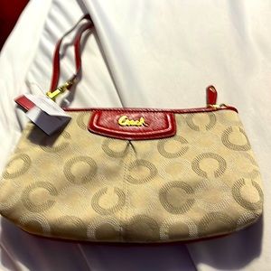 Cream colored monogrammed Coach wallet wristlet never used